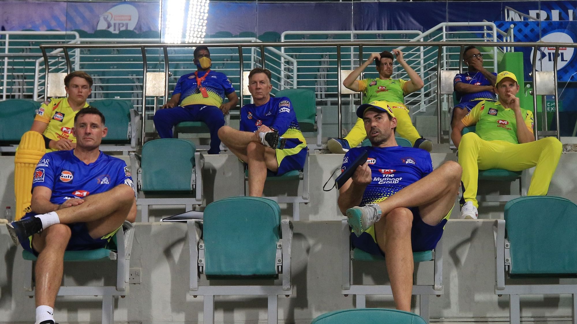 MS Dhoni CSK’s support staff and players sit in the stands, maintaining social distancing, as they watch the game against Mumbai Indians.