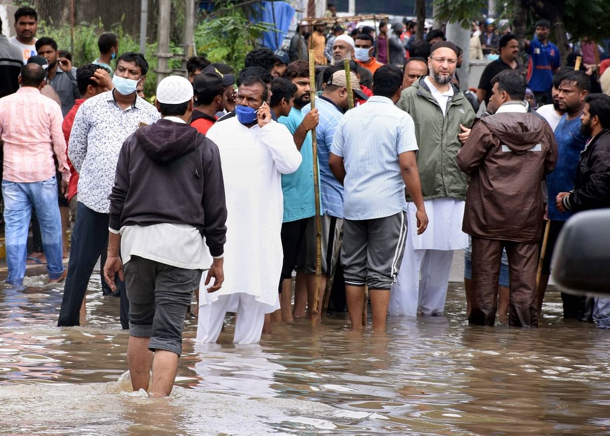 All India Majlis-e-Ittehadul Muslimeen President Asaduddin Owaisi supervises the rescue work following heavy rains, at Falaknuma Chandrangutta in the old city of Hyderabad, Wednesday, Oct. 14, 2020.