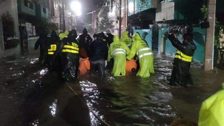 Many had to be evacuated overnight as heavy rains lashed Hyderabad, submerging roads, vehicles and flooding houses.