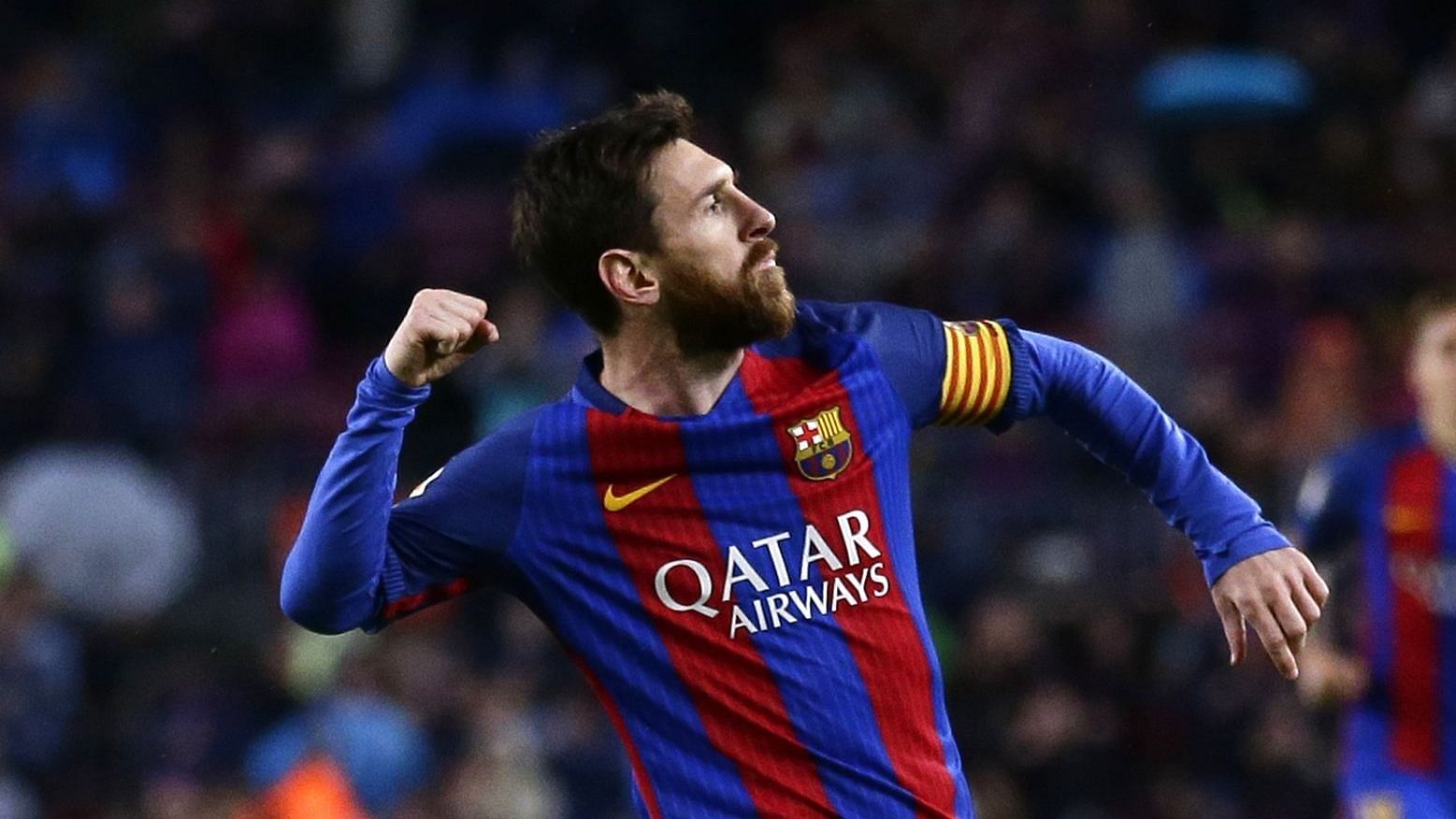 FC Barcelona’s Lionel Messi, left, celebrates after scoring during the Spanish La Liga match between FC Barcelona and Osasuna.
