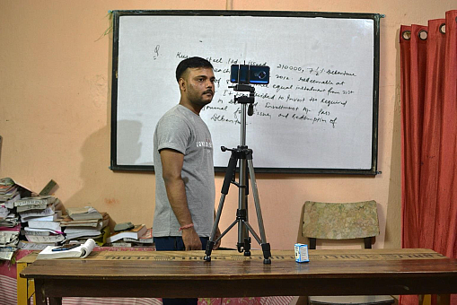 Ajay borrowed a tripod stand to start with online classes.