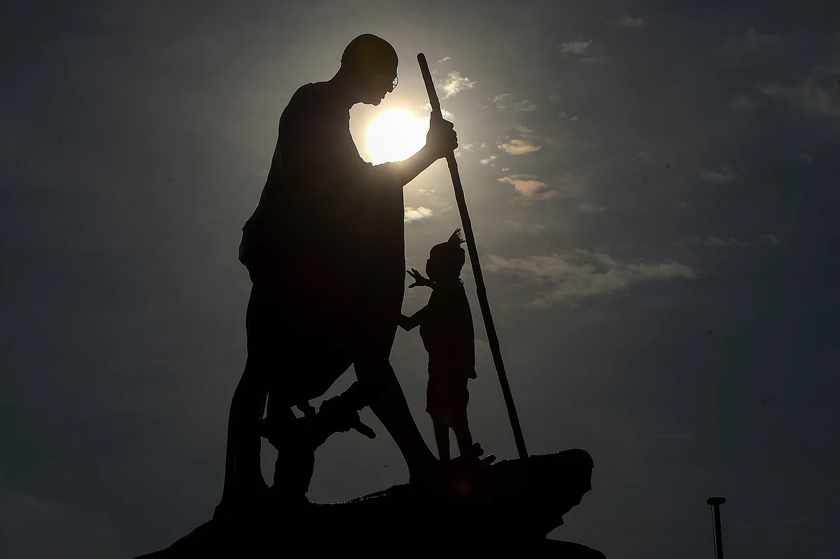 A worker cleans Mahatama Gandhi statue on the eve of his birth anniversary at Marinabeach, in Chennai. On Thursday, 1 October. 