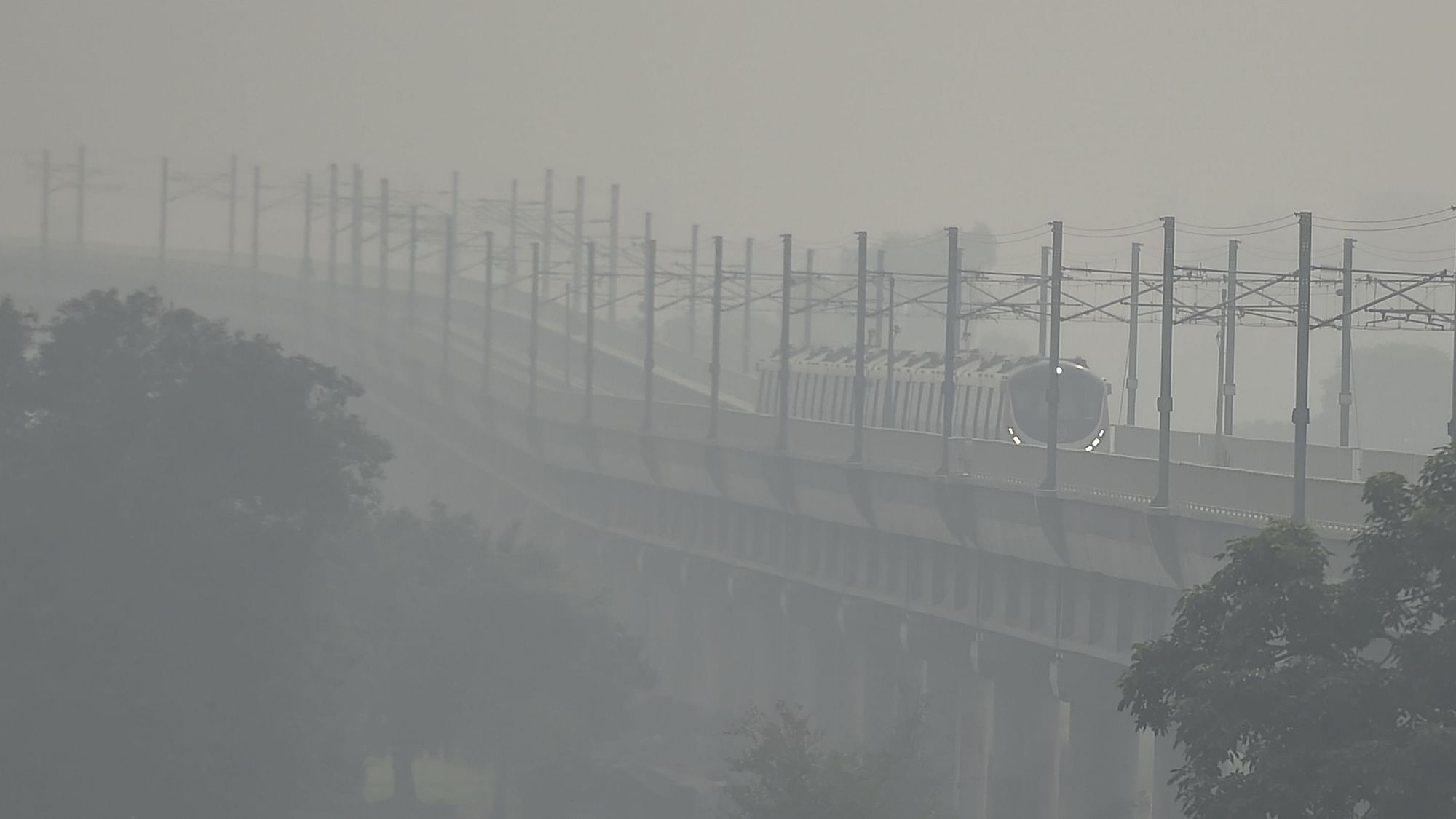  A metro train runs on a track in hazy weather, in New Delhi, Wednesday, 14 October, 2020. Image used for representation only.