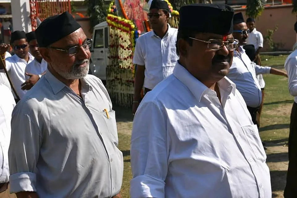 A older picture of LJP candidate from Kadwa Chandra Bhushan Thakur (Left) at an RSS function
