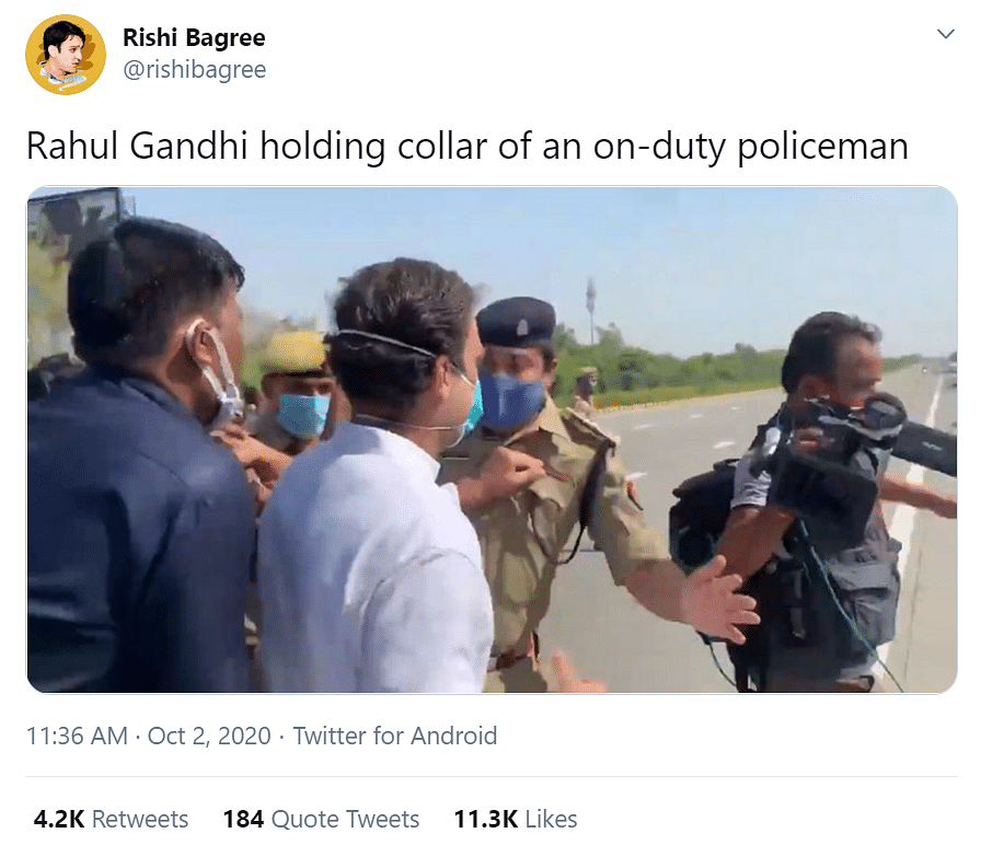 An image is being used to claim that Rahul Gandhi held the collar of a UP cop, even though he just pushed him aside.