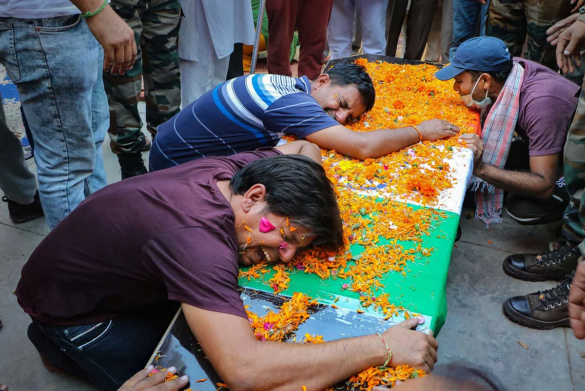 Family members of martyr Army JCO Sukhdev Singh mourn after his mortal remains arrive, at Peoni village in Majalta Tehsil Udhampur district. Singh lost his life in a ceasefire violation by Pakistan along the LoC in Nowshera sector of Rajouri district.