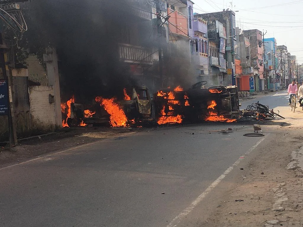 Munger Unrest: Cops on Patrol After Angry Mob Torches Police Vans