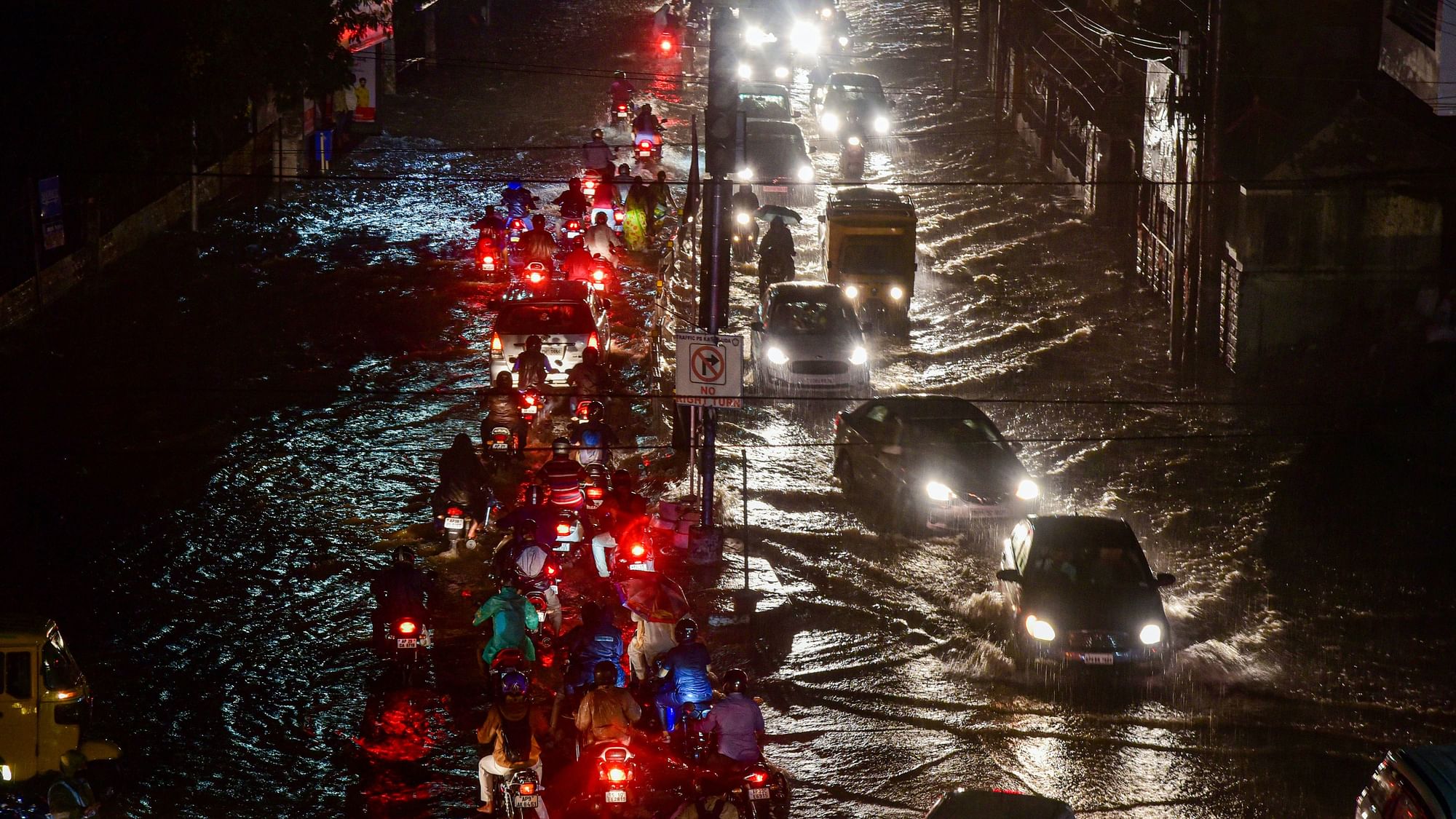 Vehicles ply on a waterlogged street, in Hyderabad, on Saturday. Image used for representational purpose only.
