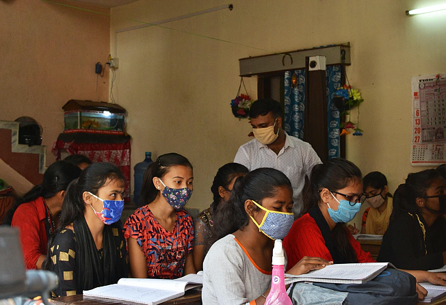 Ajay monitoring students individually and attending to their doubts.