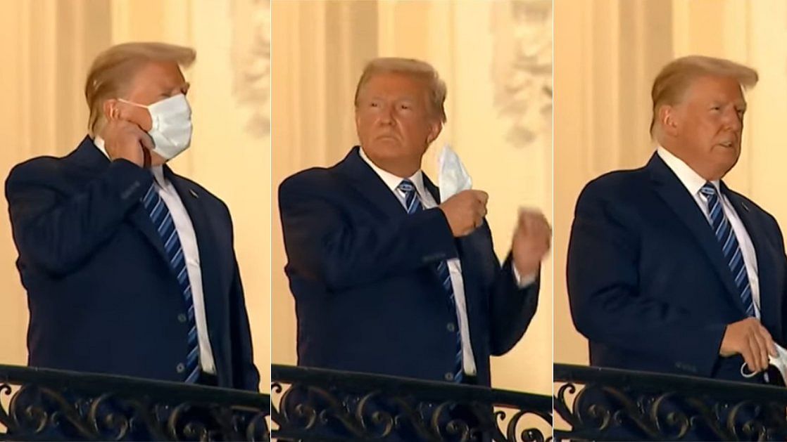 US President Donald Trump removes his mask after returning to White House.