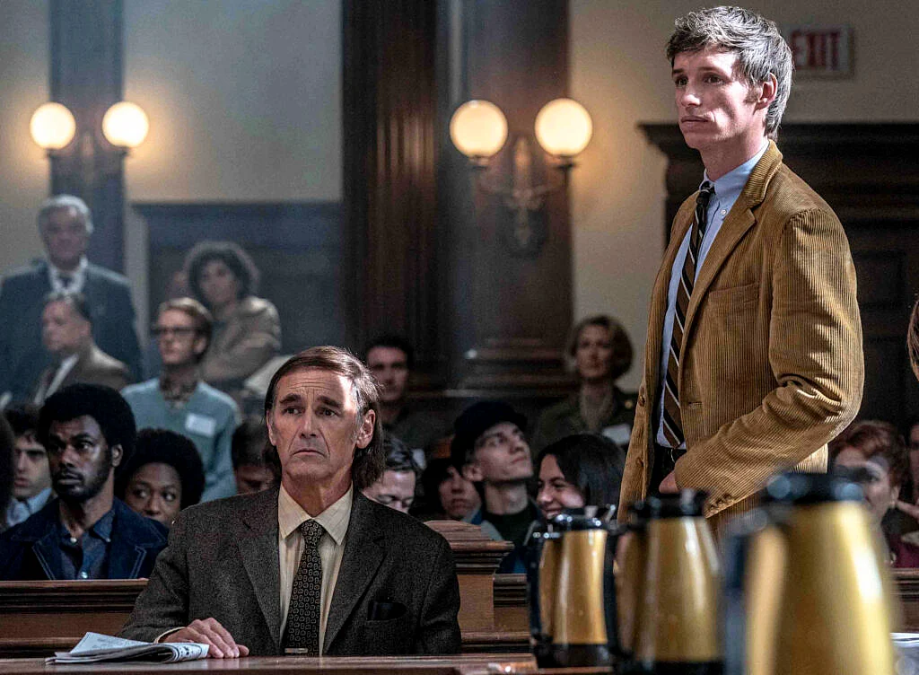 Eddie Redmayne as Tom Hayden 