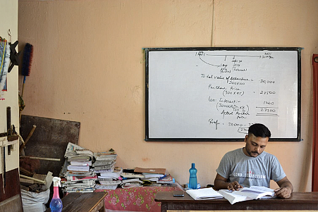 Ajay Kumar, 28, manages time between his coaching classes to prepare for the civil services exam.