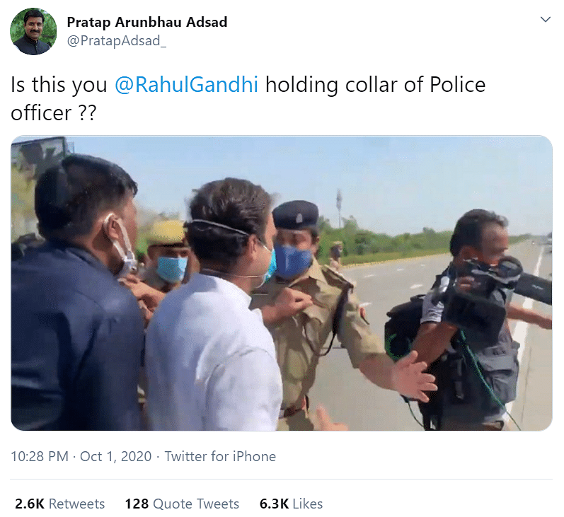 An image is being used to claim that Rahul Gandhi held the collar of a UP cop, even though he just pushed him aside.