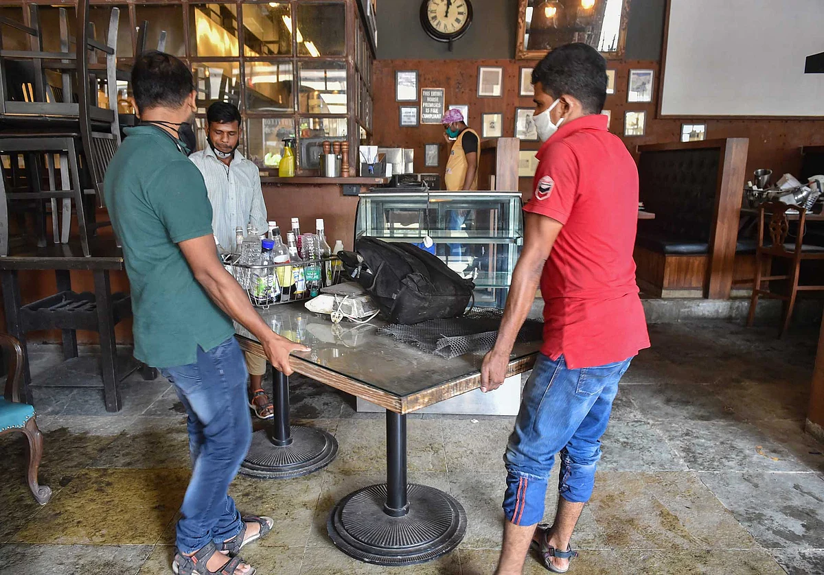 Preparations underway at a restaurant and bar ahead of its reopening after a gap of more than 6 months following the coronavirus pandemic, in Thane.