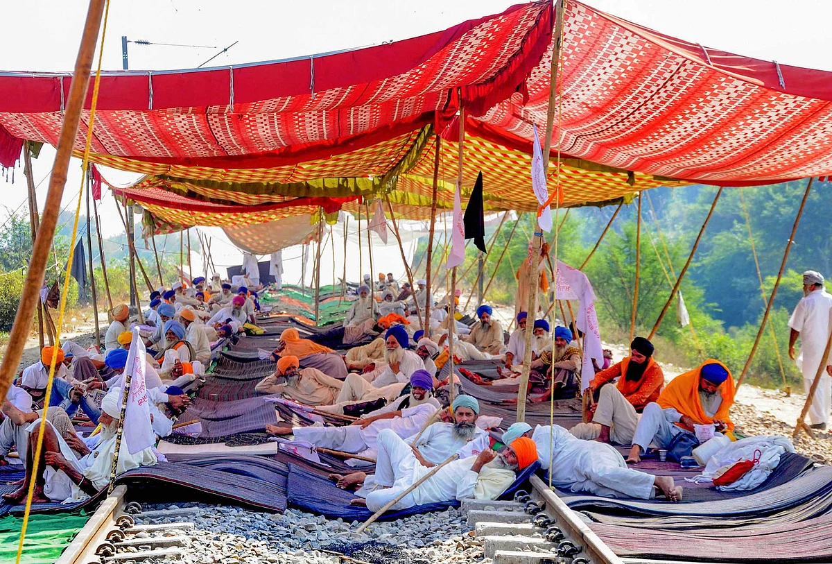 Farmers block railway tracks during the ongoing Rail Roko protest over the farm reform bills, at Devi Dass Pura village in Amritsar.