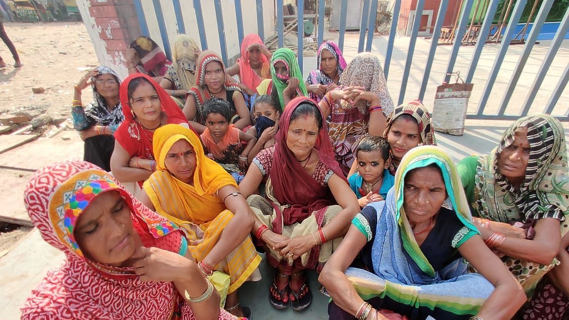 Women waiting at Noida’s labour chowk with their kids. Image used for representation.