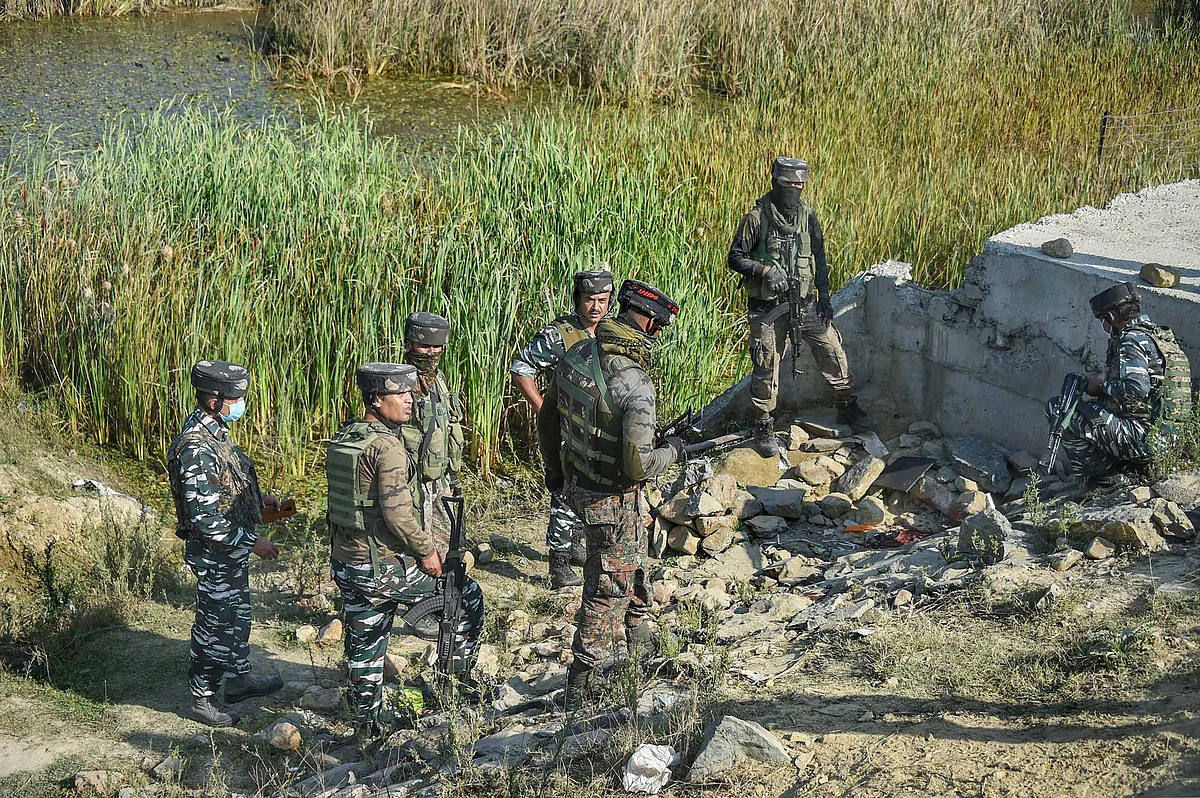 Security forces inspect the spot of a militant attack at Srinagar-Jammu National highway at Pampore, in Pulwama District of South Kashmir. Two CRPF personnel were killed and three others were injured in the attack.