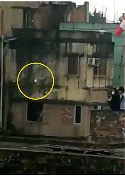 The object in yellow shows what the cops were throwing from the rooftop.