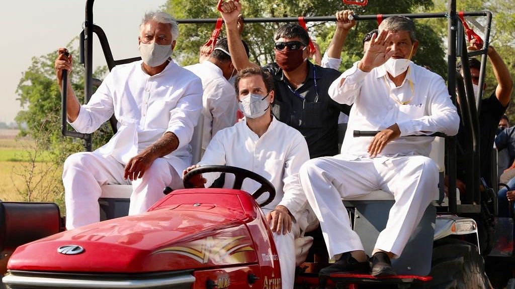 Rahul Gandhi drives a tractor at the Kheti Bachao Rally.