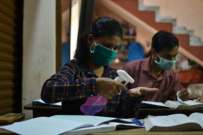 Students sanitising themselves before starting class.