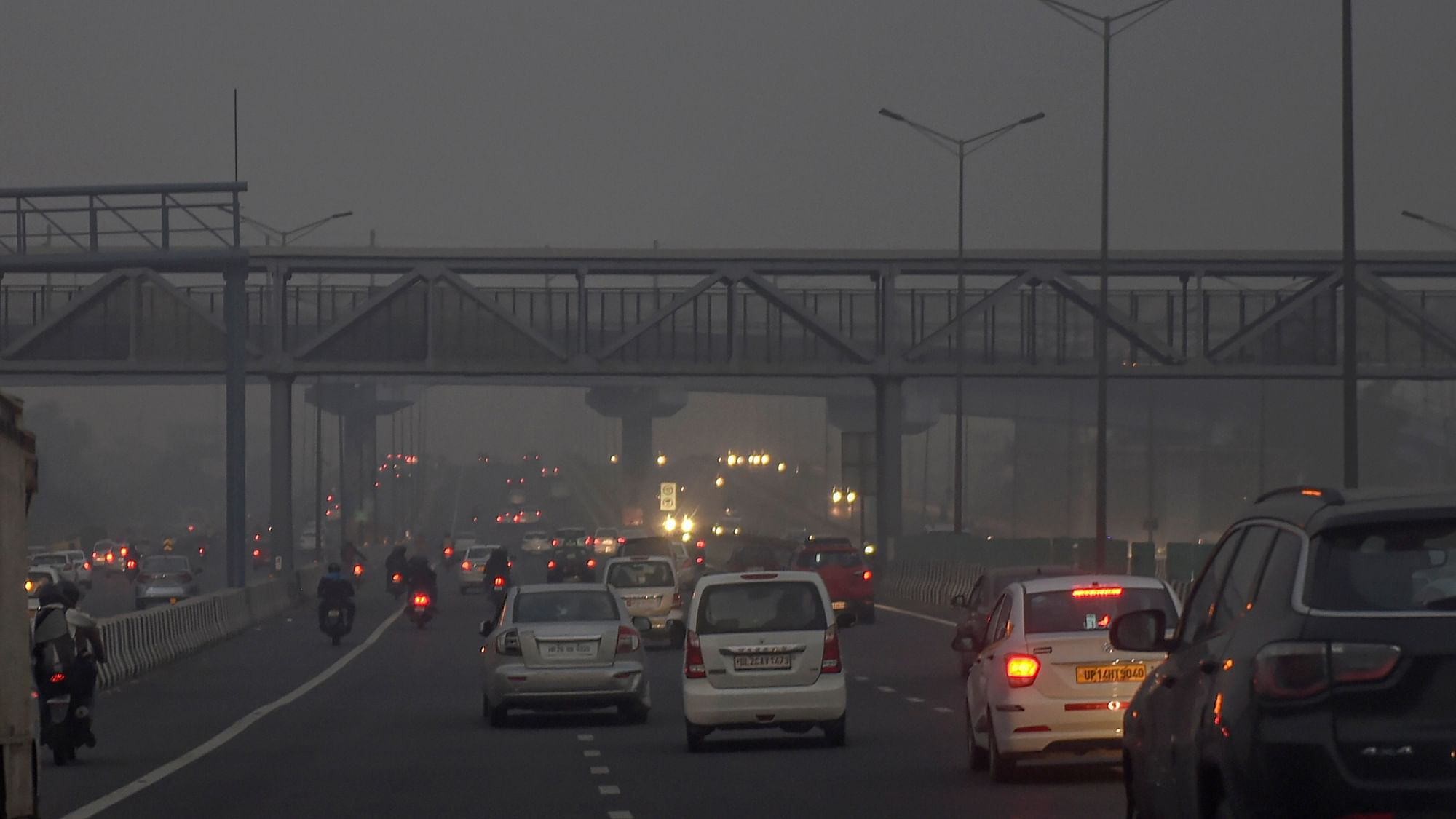 Vehicles ply on a street, amid hazy weather conditions, in New Delhi, Sunday, 8 November 2020. Representational image only.