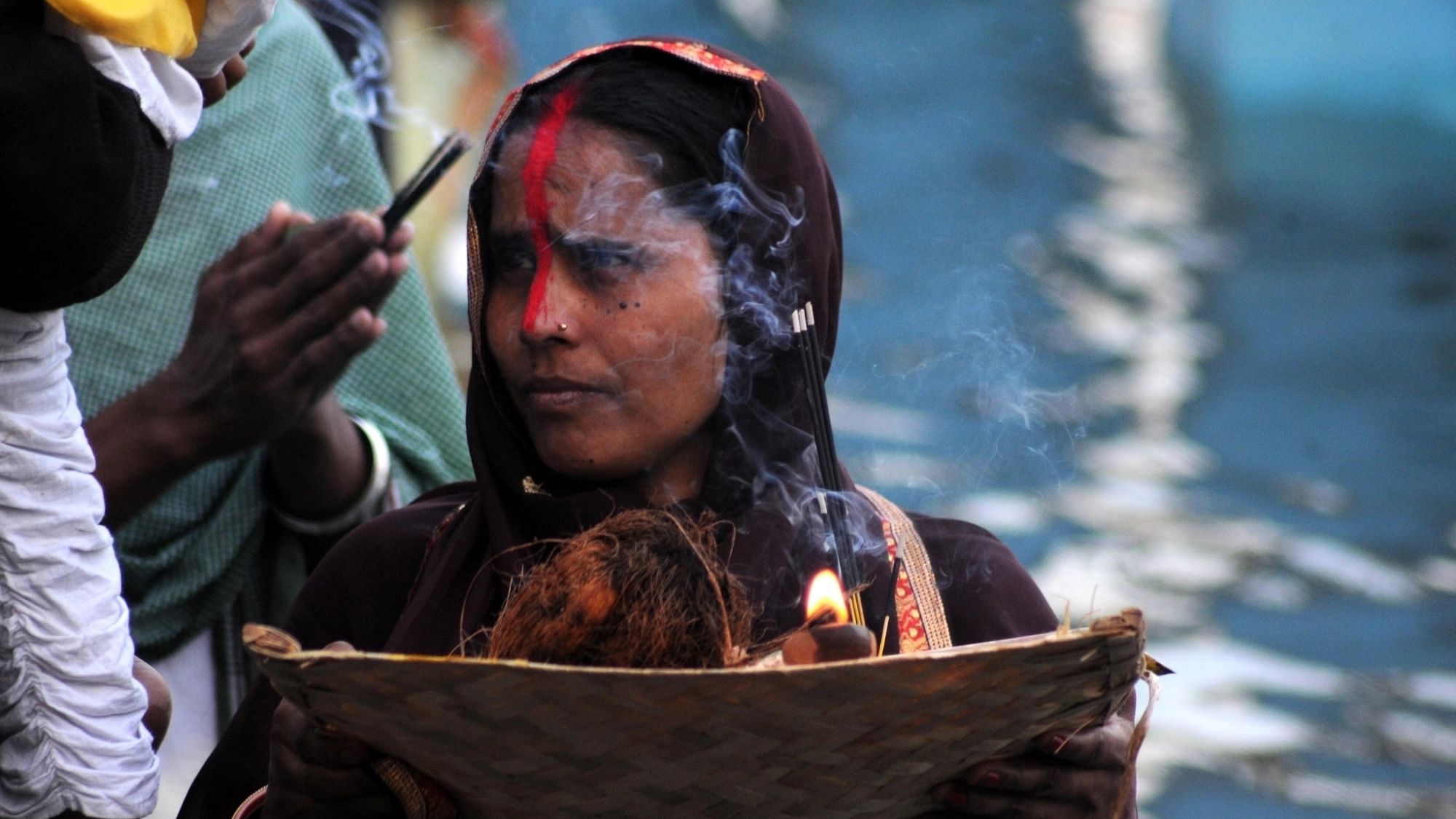 Devotees perform rituals during Chhath Puja at Shri Durgiana Temple in Amritsar. 