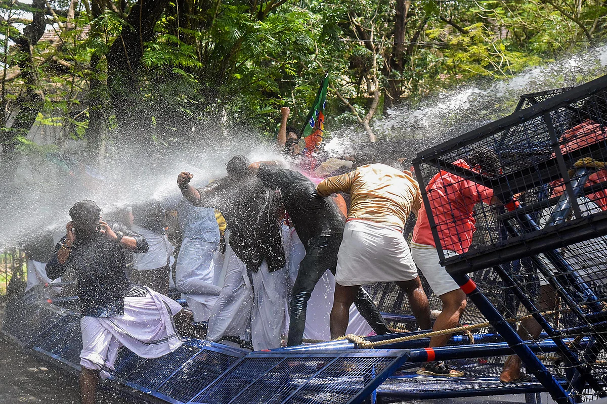 Police uses water cannons to disperse Yuva Morcha activist protesting against Kerala Chief Minister Pinarayi Vijayan, in Kochi.