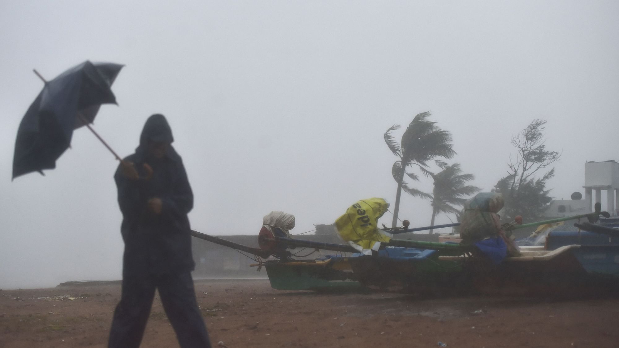 Fishermen move their boats to a safer place near Mamallapuram before the landfall of Cyclone Nivar.