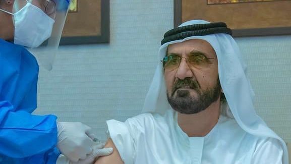 Sheikh Mohammed shared a picture on Twitter of him getting vaccinated by a medical staffer.