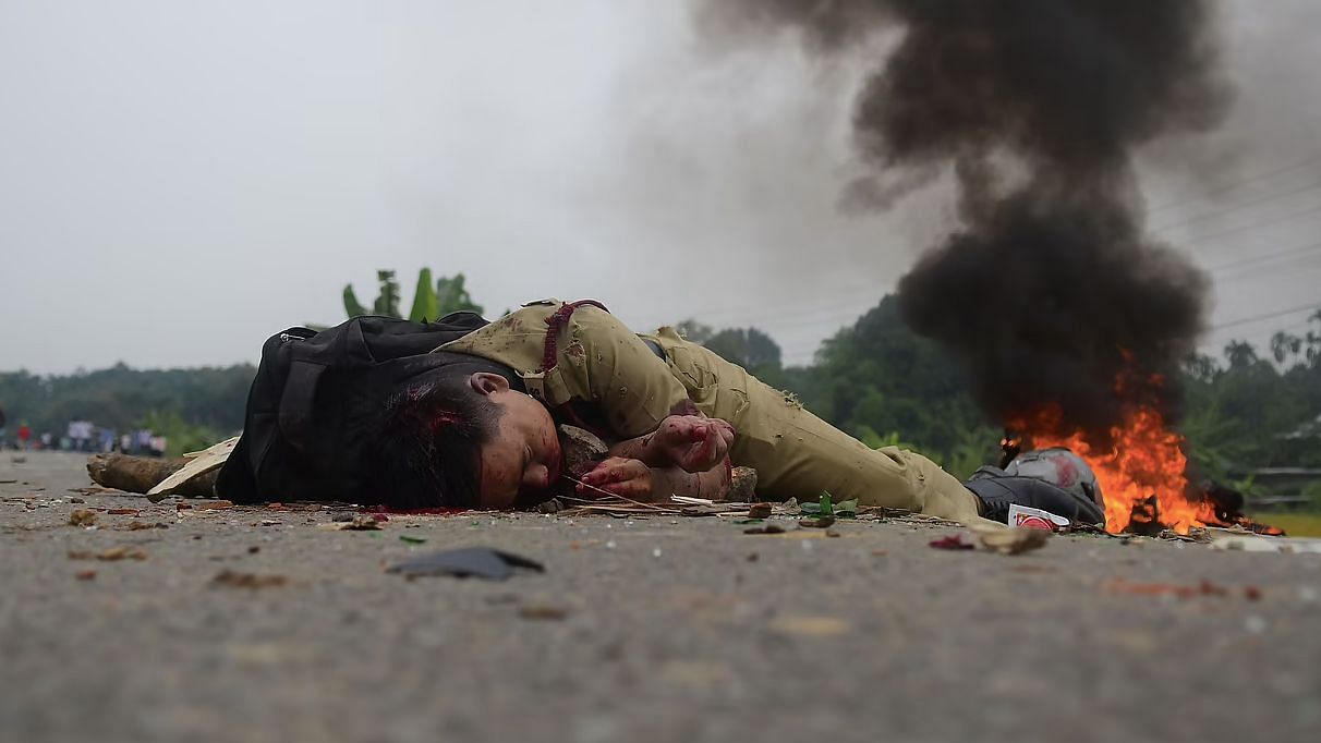 A fireman lying on national highway 8 in Panisagar after being lynched by the angry mob on Saturday last.