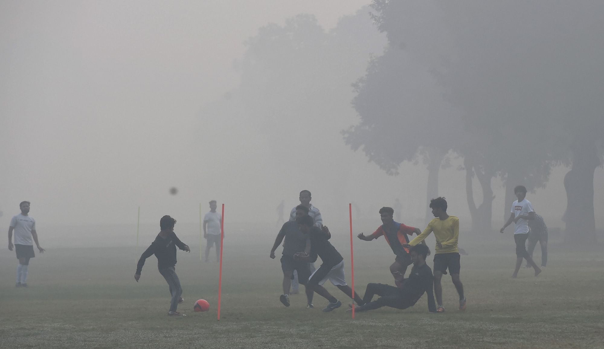 Children play football mids low visibility and smog conditions in Delhi on 15 November. Image used for representation only.