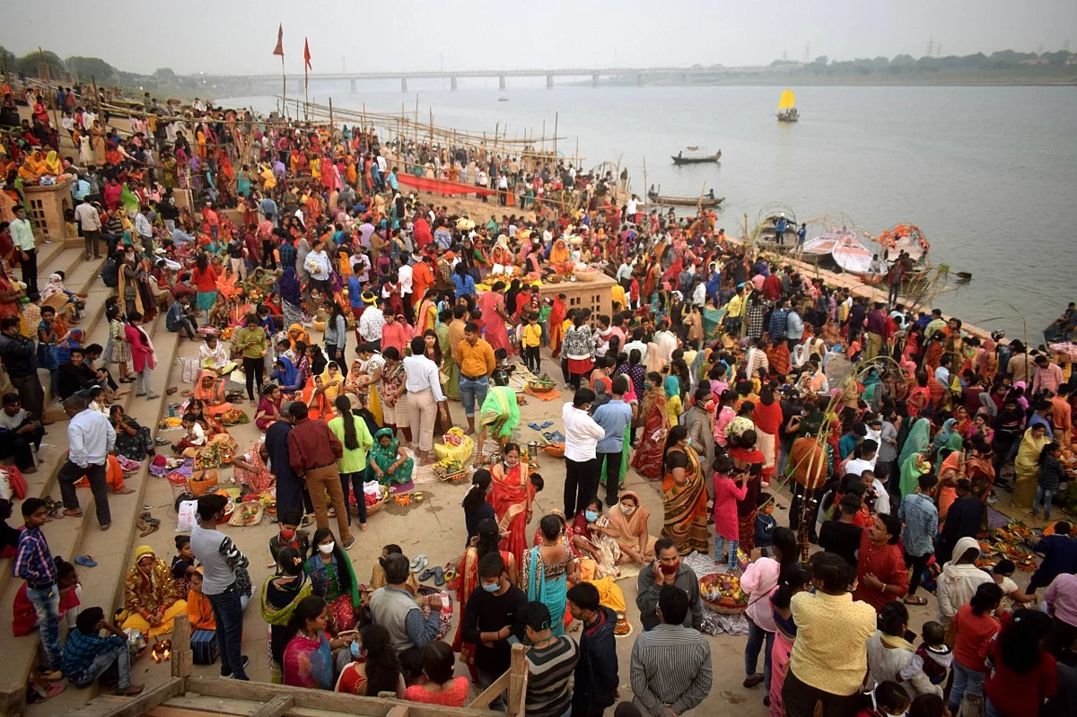 Devotees offer prayers on the banks of Yamuna river on the occasion of Chhath Puja festival in Prayagraj.