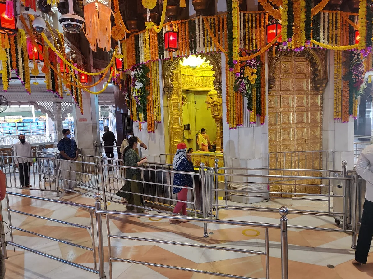 Devotees practise social distancing inside the Siddhivinayak temple.