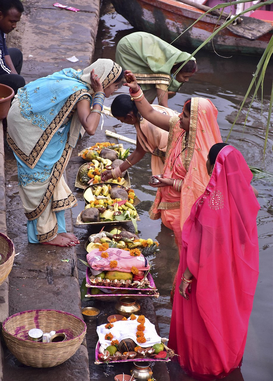 Women take part in rituals after taking a holy dip in the Narmada river on the occasion of Chhath Puja in Jabalpur.