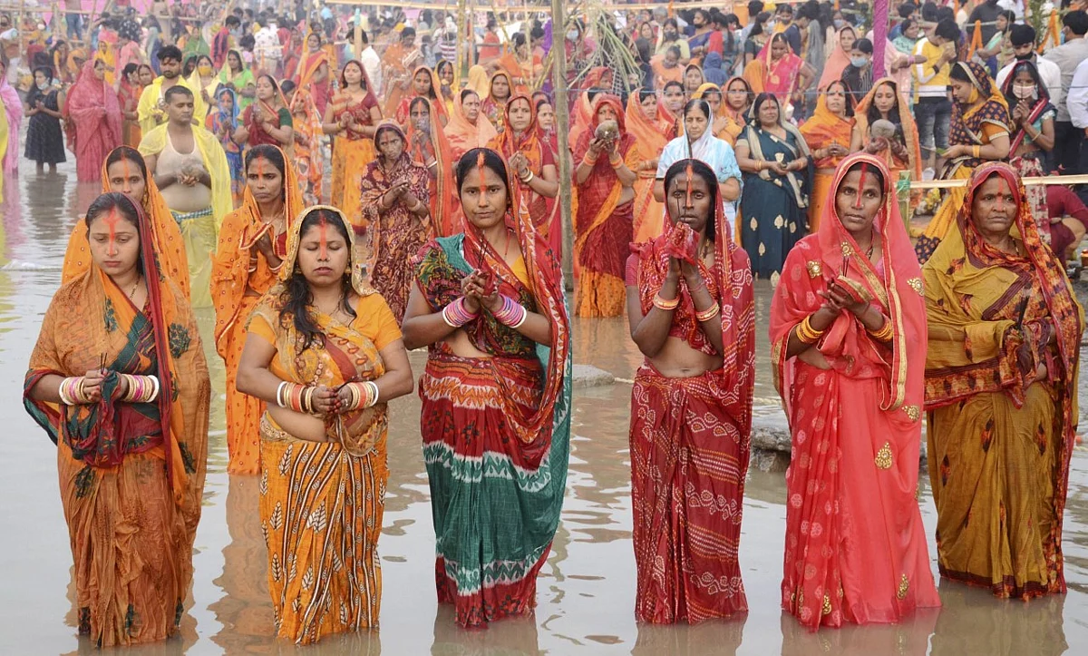 Devotees pray on the banks of Brahmaputra river on the occasion of Chhath Puja in Guwahati.