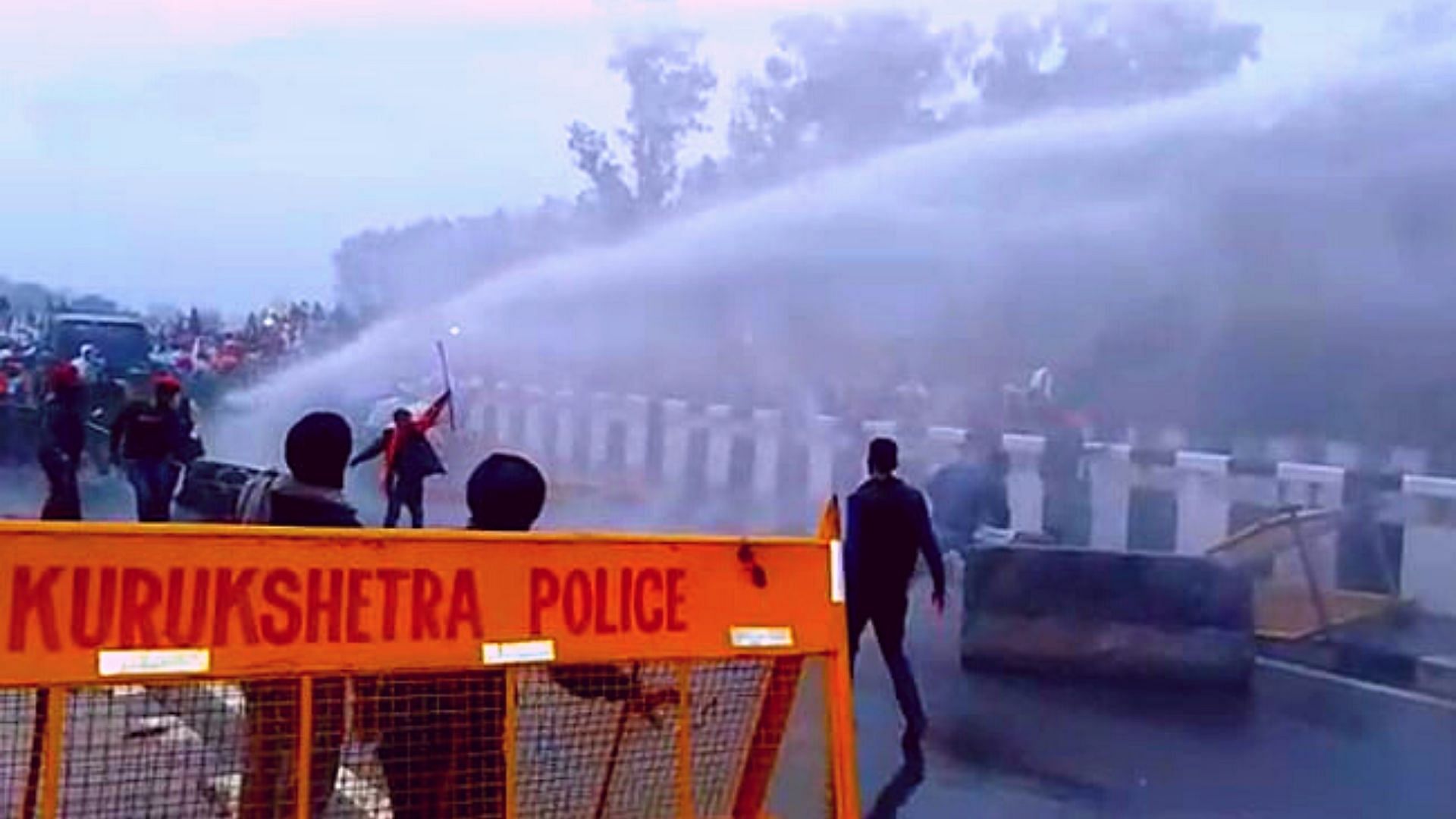 Police deployed water cannons to disperse farmers .
