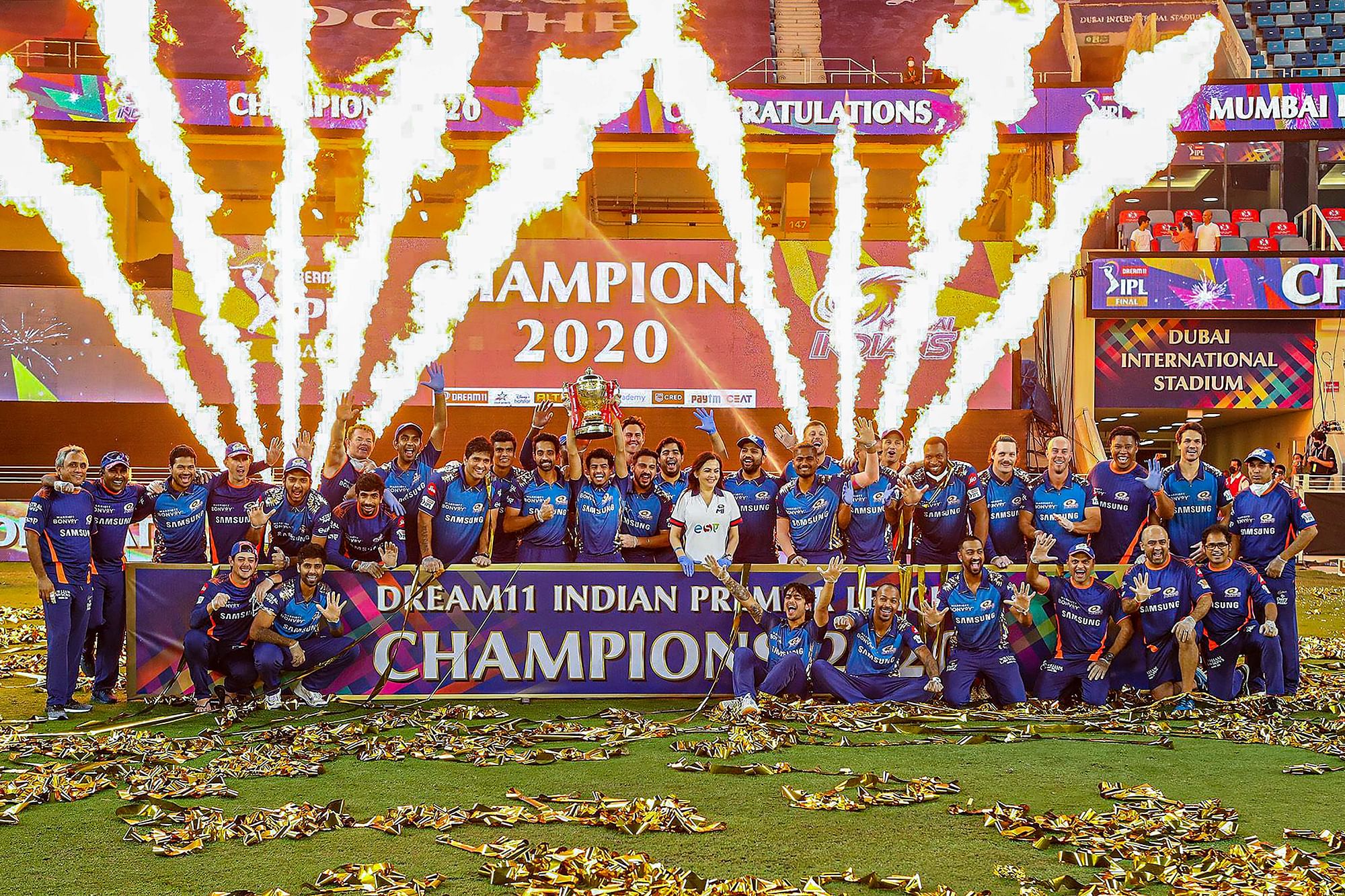 Mumbai Indians pose with the trophy after winning the final cricket match of the Indian Premier League (IPL) T20 against Delhi Capitals, at Dubai International Cricket Stadium in Dubai, Tuesday, 10 November, 2020.