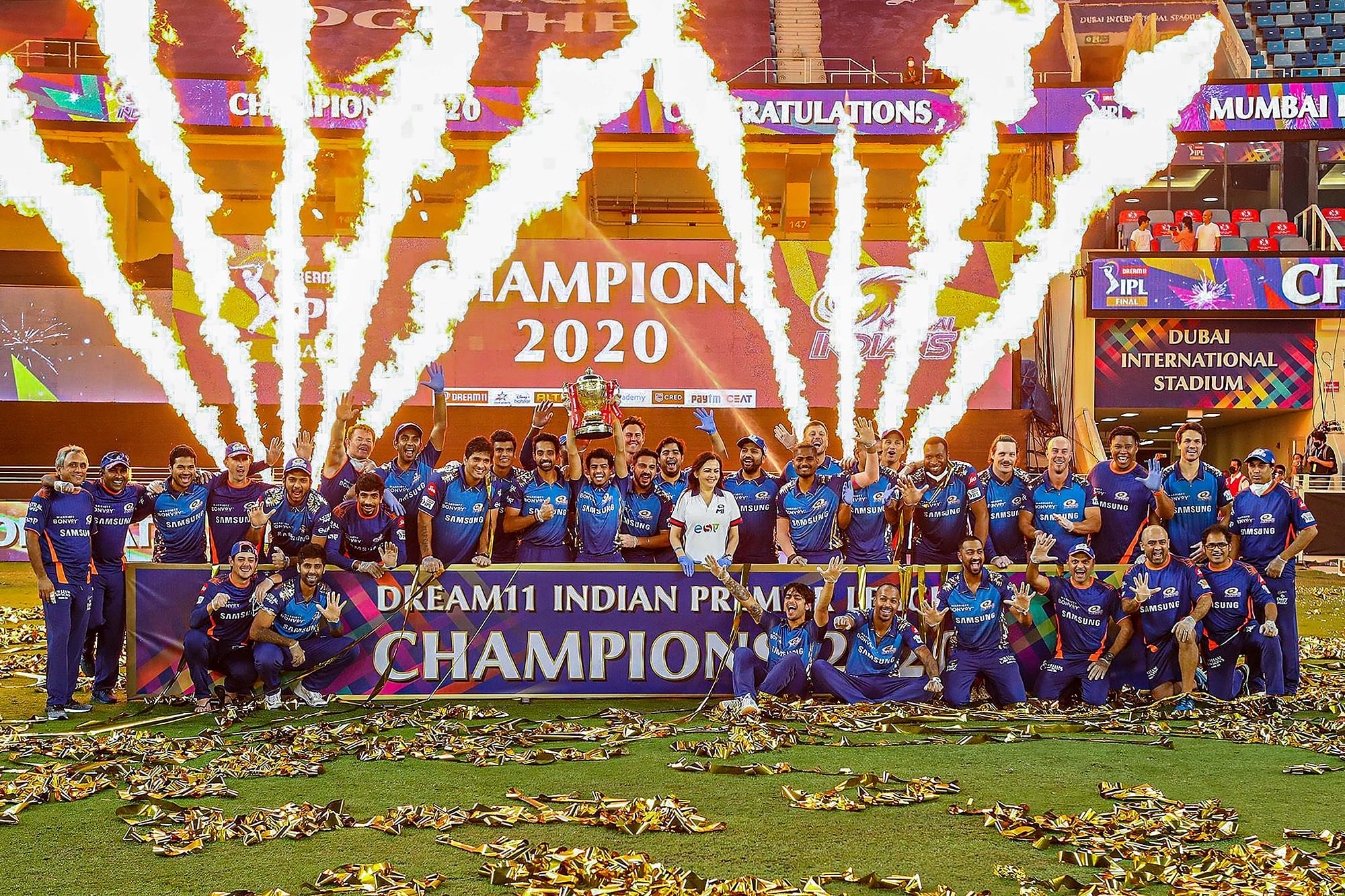 The Mumbai Indians pose with the trophy after winning the final T20 Indian Premier League (IPL) cricket match against Delhi Capitals, at the Dubai International Cricket Stadium in Dubai, Tuesday, Nov. 10, 2020.