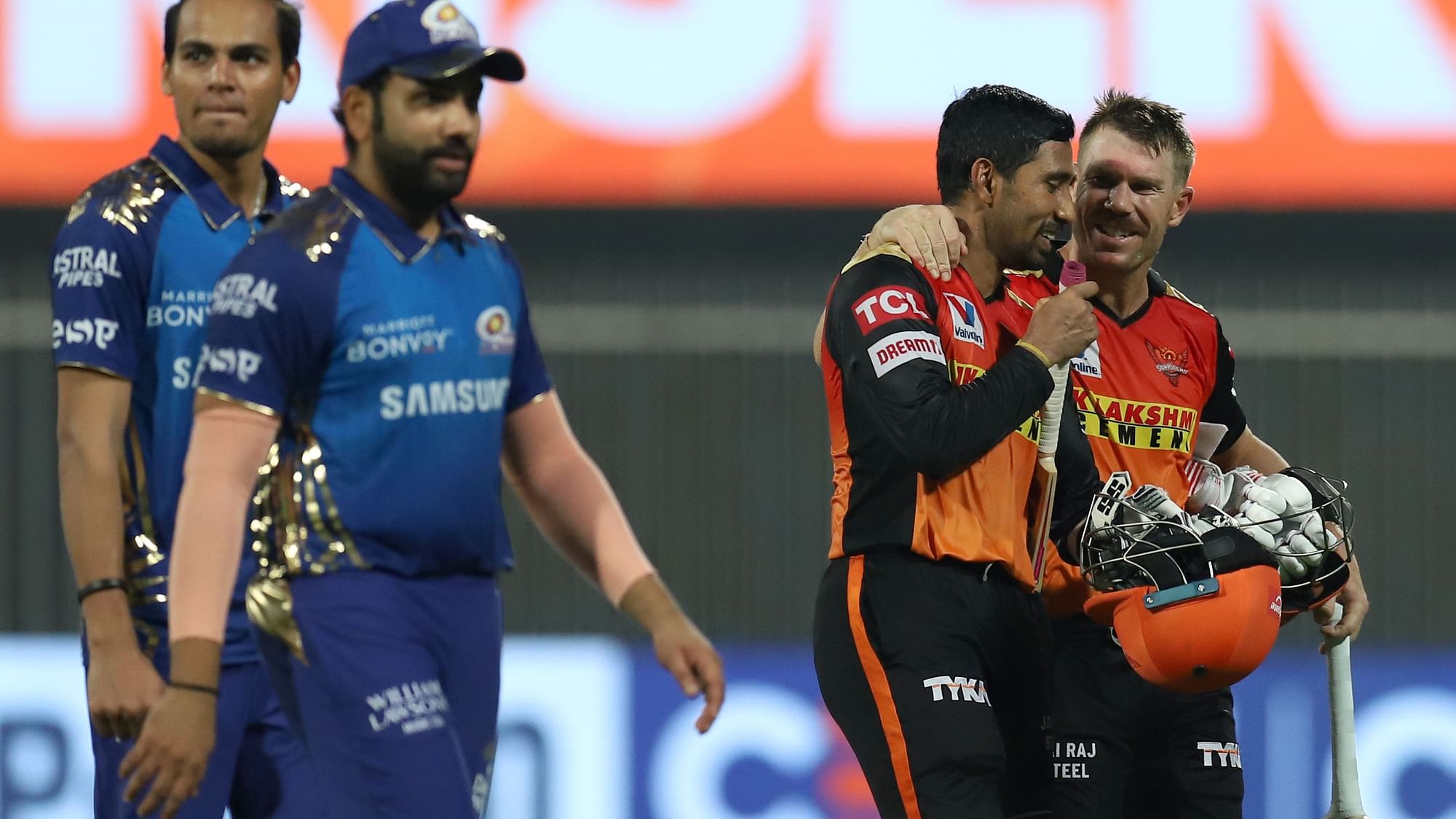 David Warner and Wriddhiman Saha’s fifties took SRH over the line by 10 wickets against MI