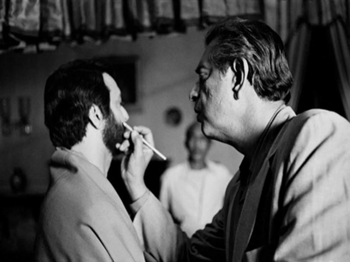 Satyajit Ray doing Soumitra Chatterjee's make-upduring the shoot of 'Apur Sansar'