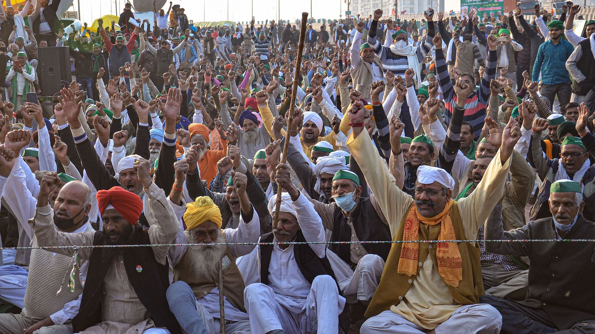 Farmers shout slogans during their protest against the new farm laws, at Ghazipur Border in New Delhi, Wednesday, 23 December, 2020.  