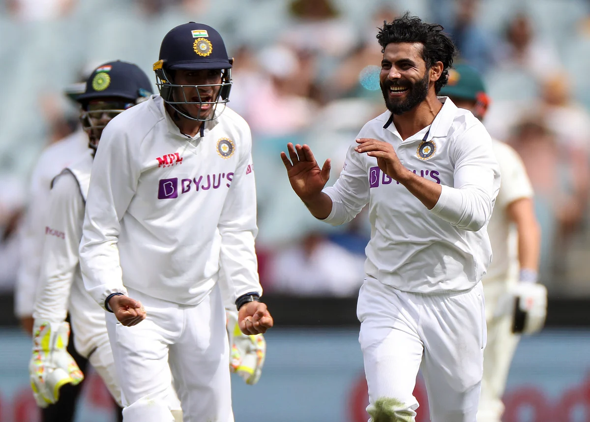 Ravindra Jadeja, right, celebrates after taking the wicket of Australia’s Matthew Wade during day three of the second test between India and Australia at the Melbourne Cricket Ground.