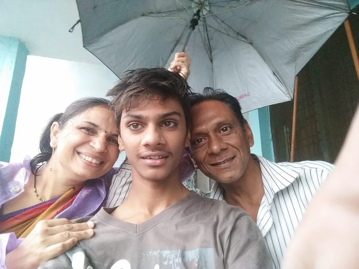 Shivam with his parents.