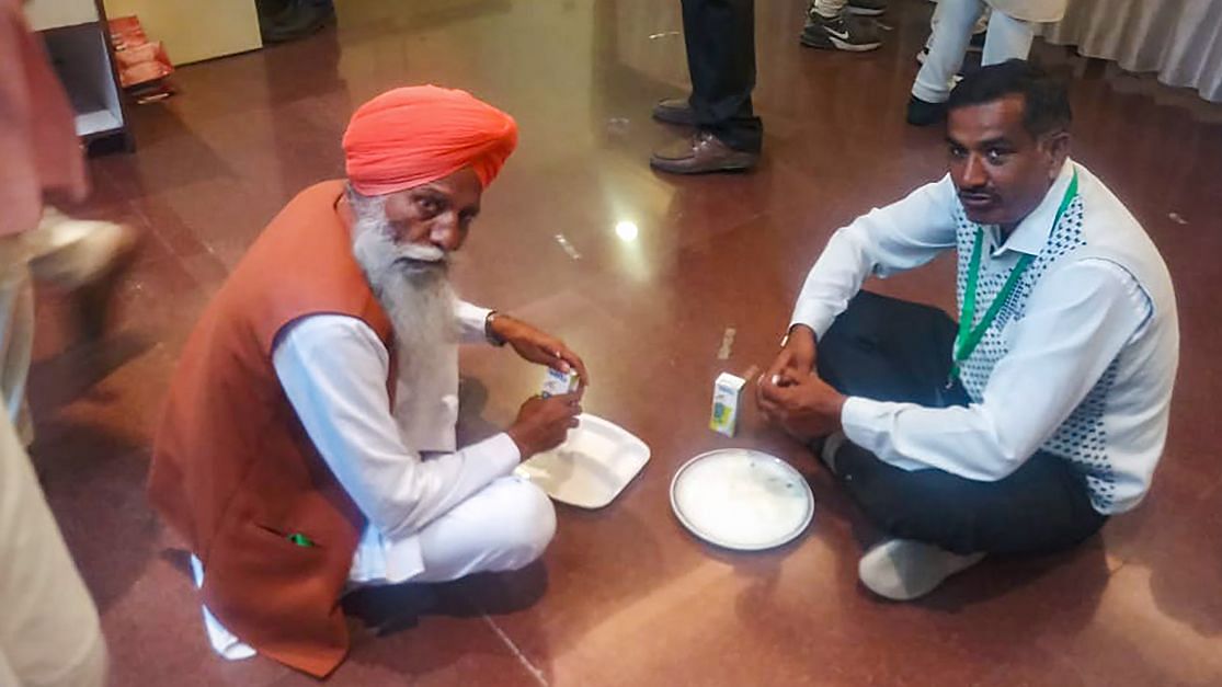 Farmers representatives, holding talks with the Centre, having their own food (langar) during the lunch break, at Vigyan Bhawan in New Delhi.