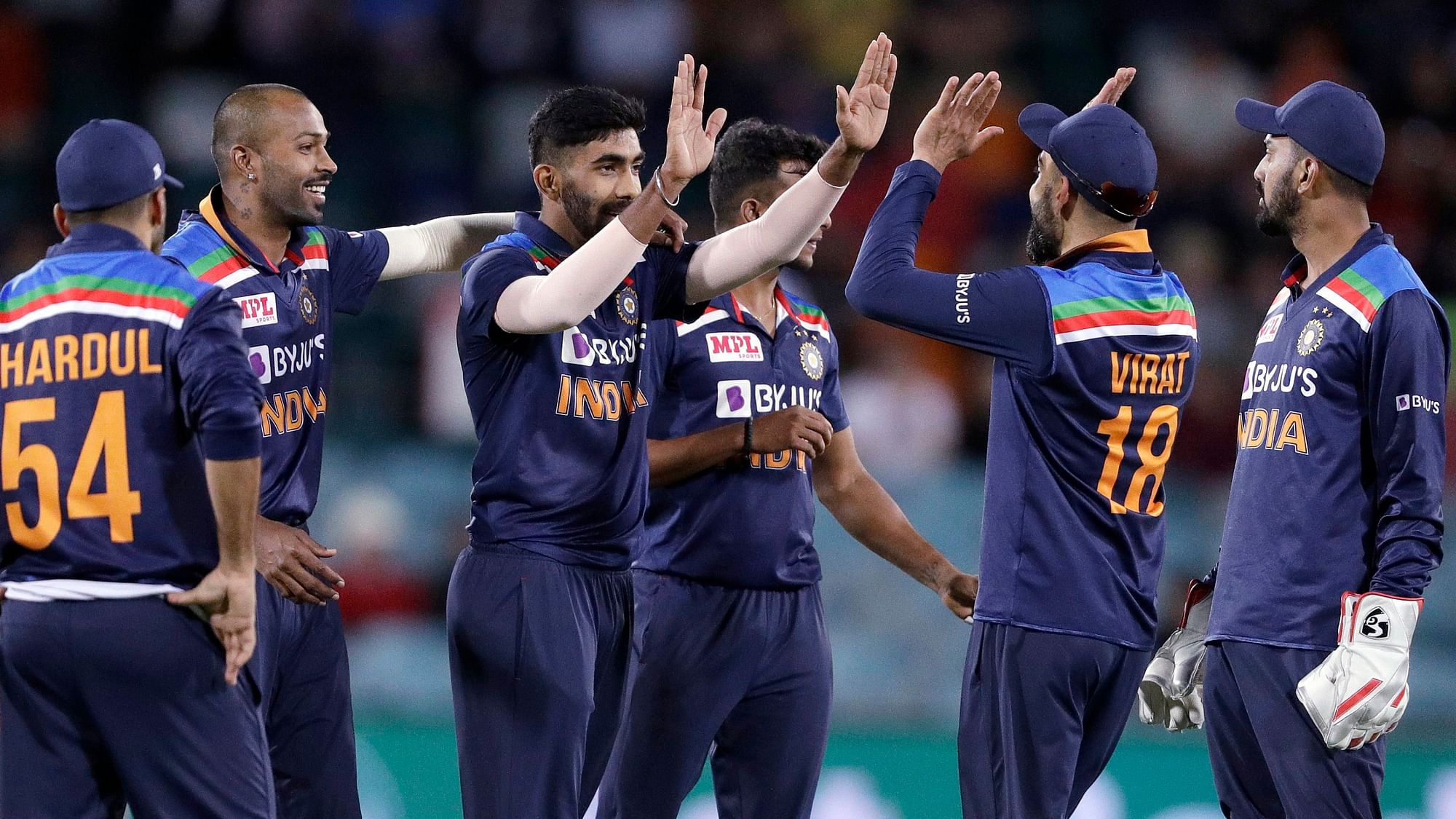 Jasprit Bumrah and the Indian team celebrate the win against Australia in Canberra.&nbsp;