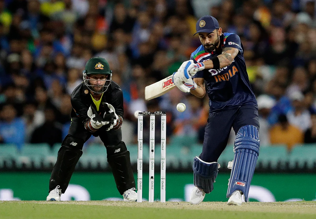 India’s captain Virat Kohli, right, bats during the third T20 international between Australia and India at the Sydney Cricket Ground in Sydney.