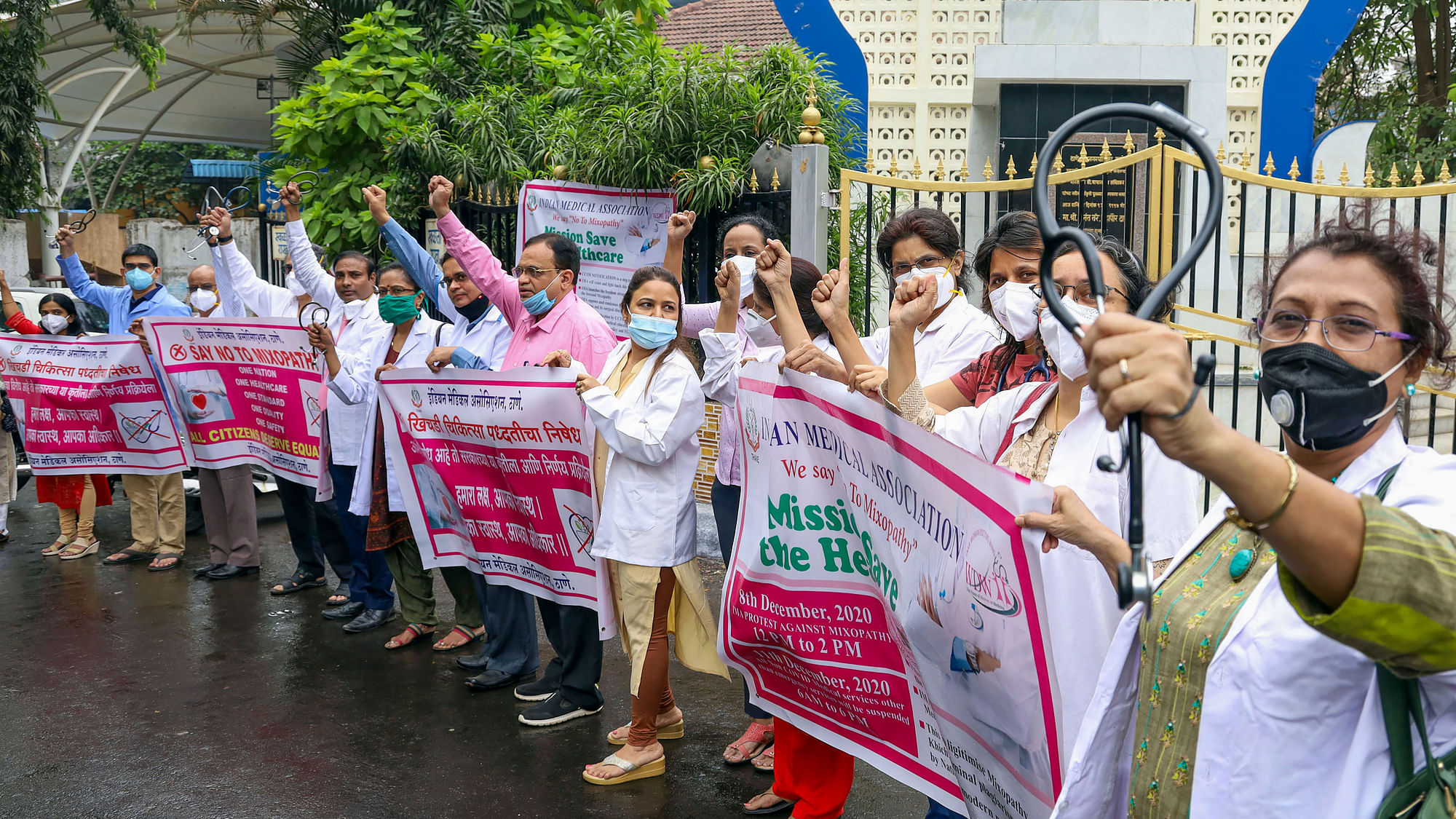 Doctors hold banners during their strike, demanding the withdrawal of CCIM notification, in Thane, Friday, 11 December 2020.