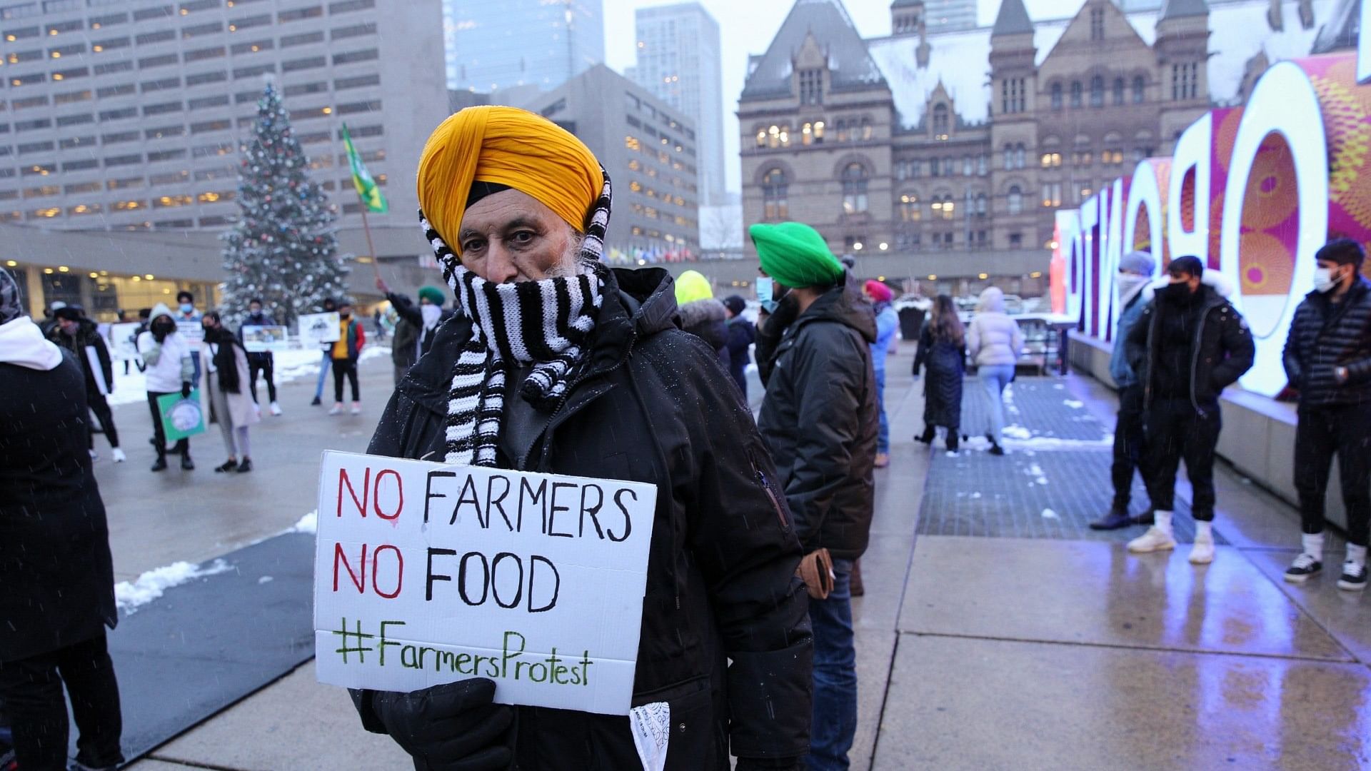Protesters stand in support of Indian farmers.