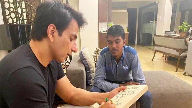 Sonu Sood with a fan, who started cycling from Bihar to Mumbai to meet him.