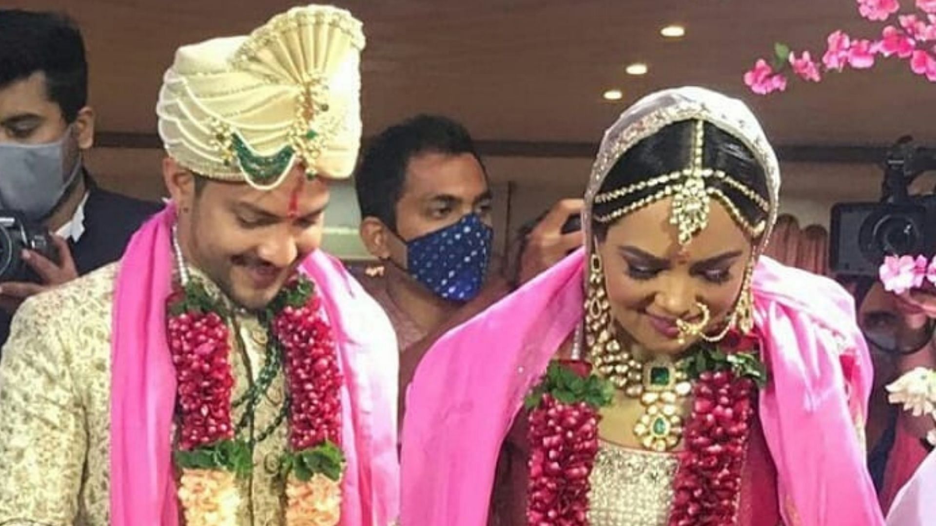 Aditya Narayan and Shweta Agarwal smile coyly during their wedding.